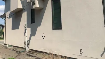 Localized stucco repairs — before
