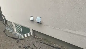 Localized stucco repairs — before