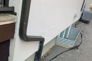 Localized stucco repairs — before