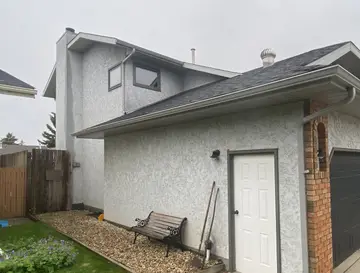 New finish over traditional stucco — before