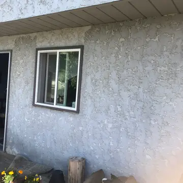 New finish over traditional stucco — before