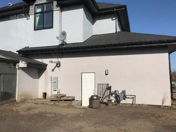 New finish over traditional stucco — before