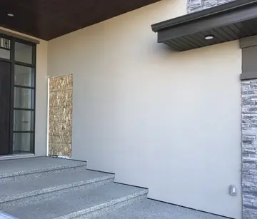 Localized stucco repairs — before