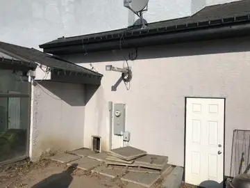 New finish over traditional stucco — before